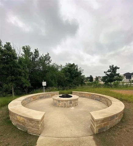 a view of a swimming pool with a yard