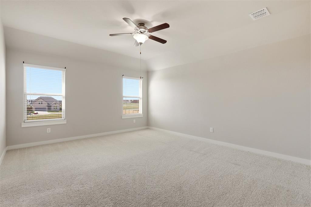 2629 Green River Road Royse City, TX 75189 - Photo 12 of 18 an empty room with windows and fan
