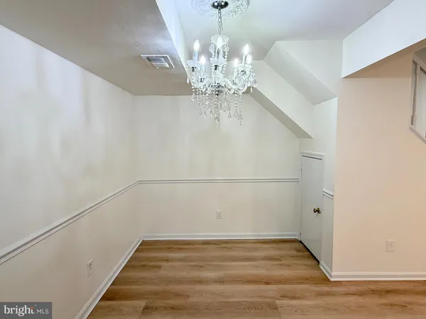 a kitchen with a stove and a white refrigerator