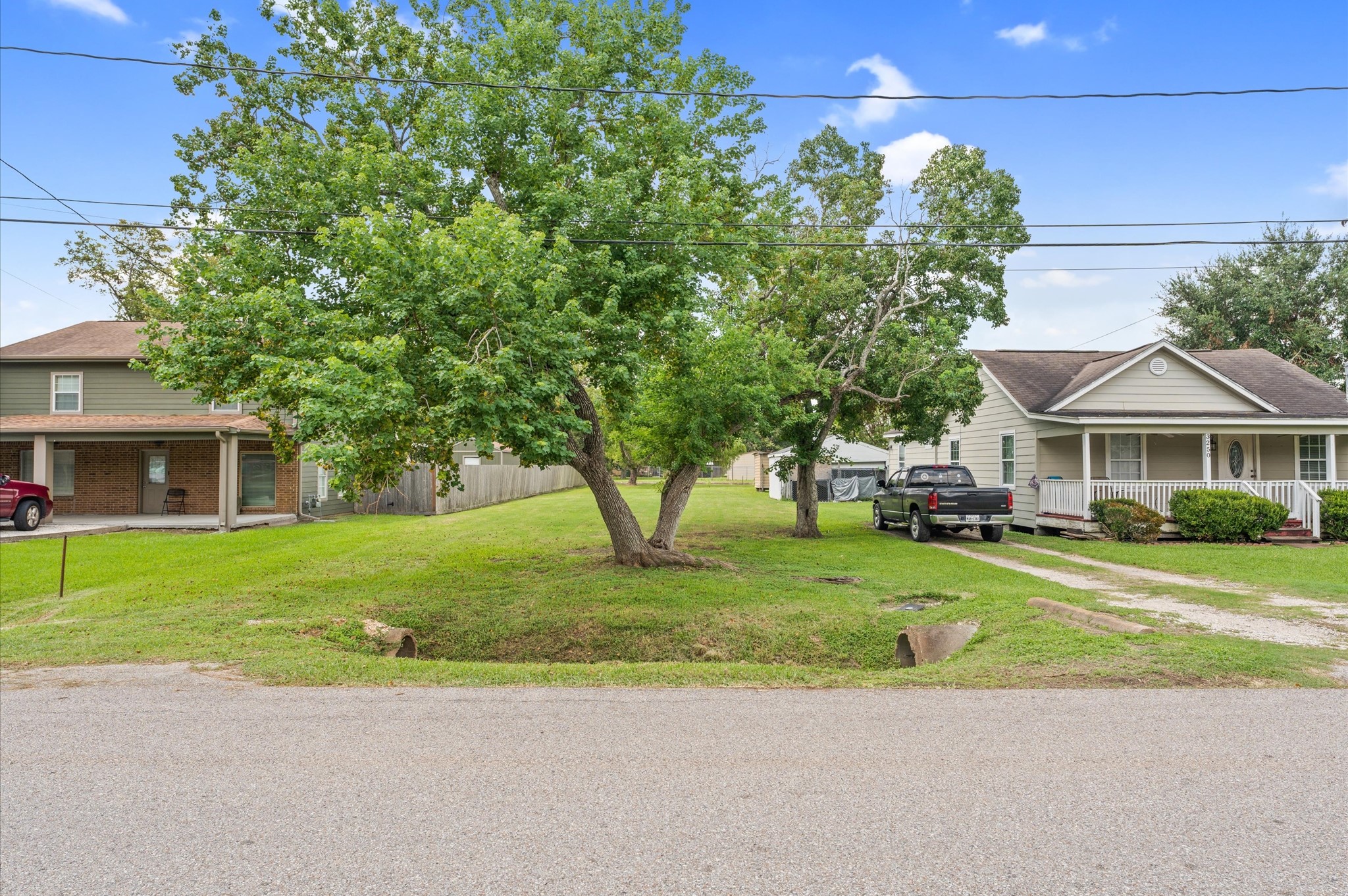 3256 Bernard Street La Porte, TX 77571 - Photo 14 of 17 a front view of a house with a garden and trees