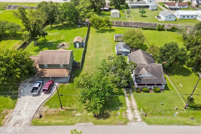 an aerial view of residential houses with outdoor space