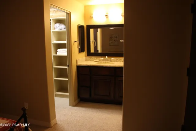 a bathroom with a sink and mirror