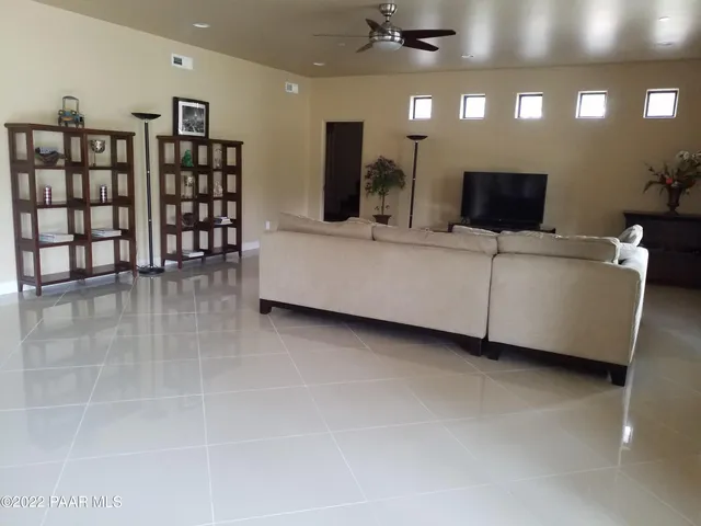 a living room with furniture a view and a projector