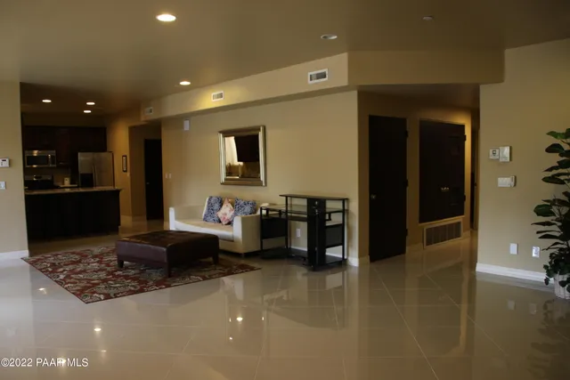 a living room with furniture and a rug