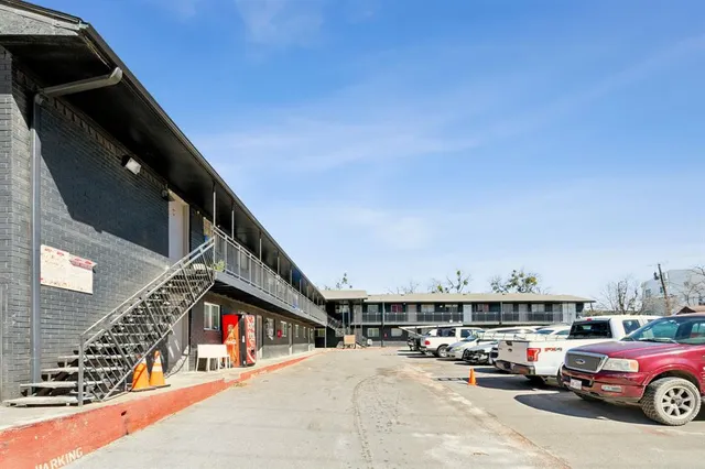 a cars parked in front of a building