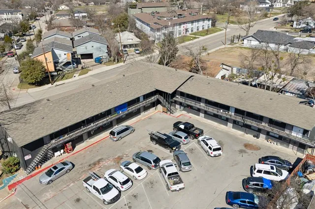 an aerial view of a house with a swimming pool