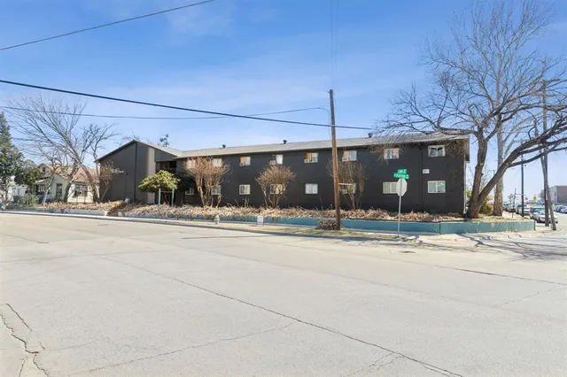 a outdoor view of a building with traffic signal lights