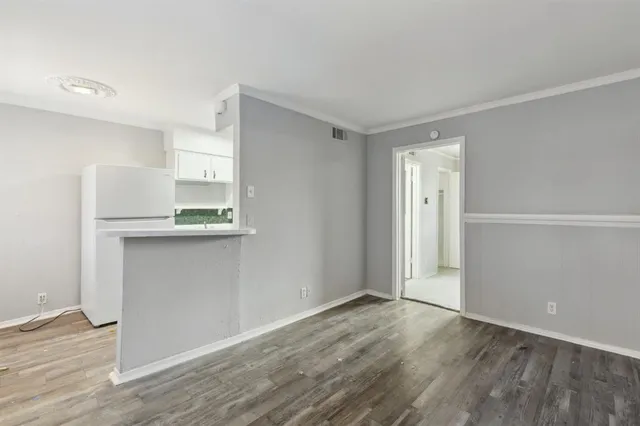 a view of kitchen with wooden floor