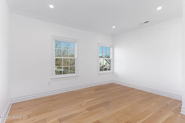 a bathroom with a granite countertop toilet a sink and a bathtub