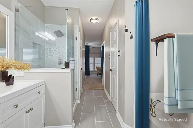 a bathroom with a tub and sink