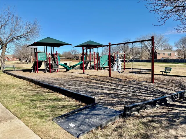a view of a park with large trees
