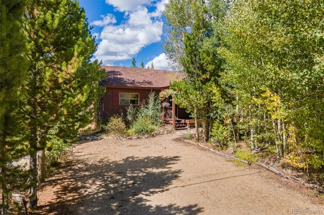 a view of a house with a tree