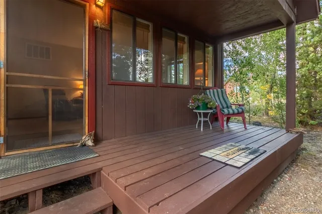 a view of a two chairs in the patio