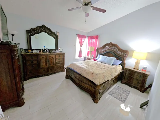 a bedroom with a bed and dresser