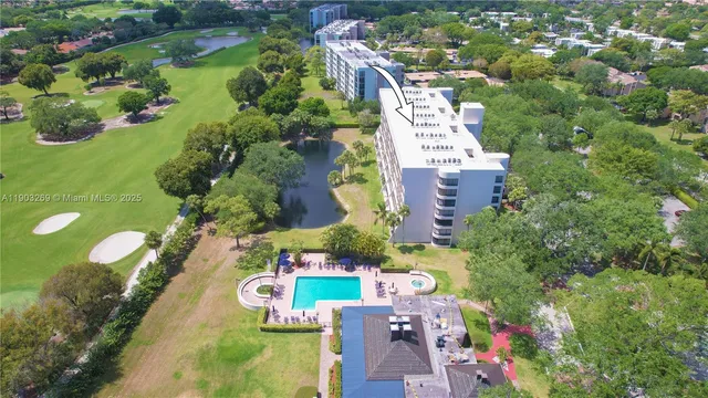 an aerial view of residential houses with outdoor space and street view
