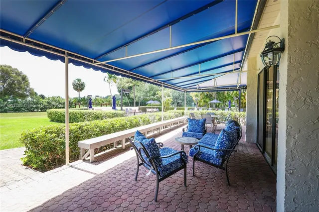 a balcony with furniture and garden view