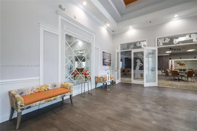 a living room with furniture and dining area