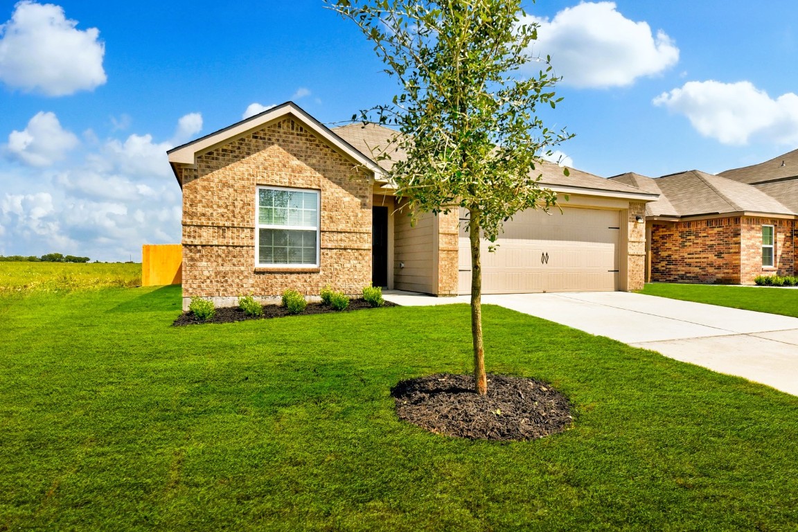 17216 Farmhouse Lane Elgin, TX 78621 - Photo 1 of 1 a view of a house with a yard