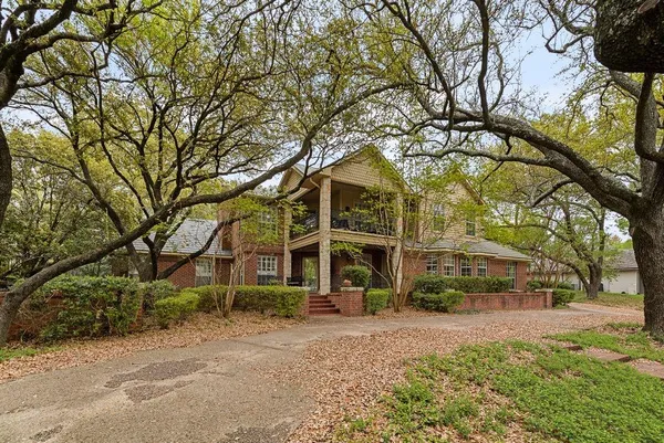 a view of a building with a yard