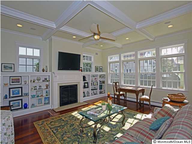196 Spring Street Red Bank, NJ 07701 - Photo 2 of 3 a living room with furniture fireplace and flat screen tv