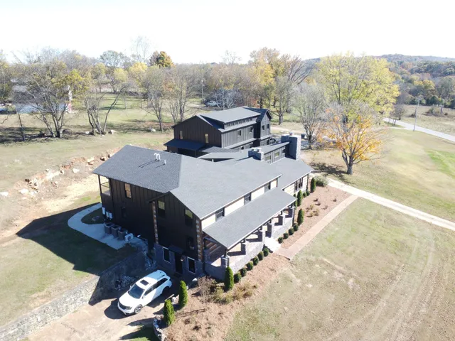 a kitchen with kitchen island granite countertop a sink and a stove