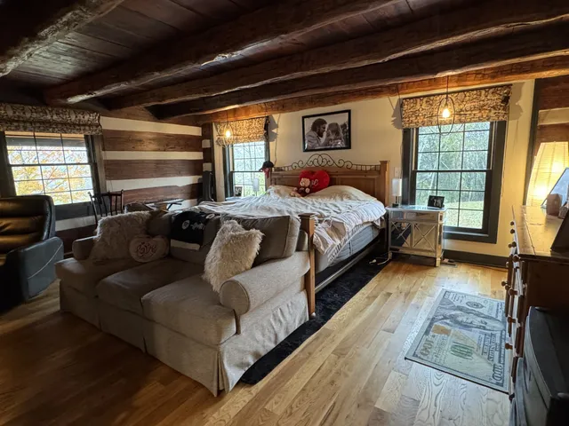 a view of an entryway with wooden floor
