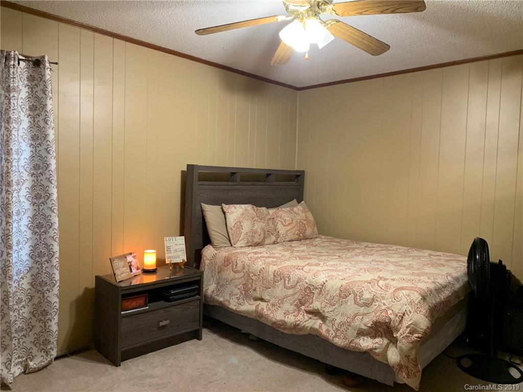 530 South Potter Road Lancaster, SC 29720 - Photo 12 of 21 a bedroom with a bed and lamp
