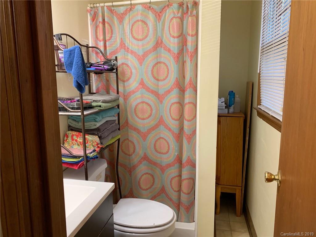 530 South Potter Road Lancaster, SC 29720 - Photo 13 of 21 a bathroom with a toilet and shower curtain