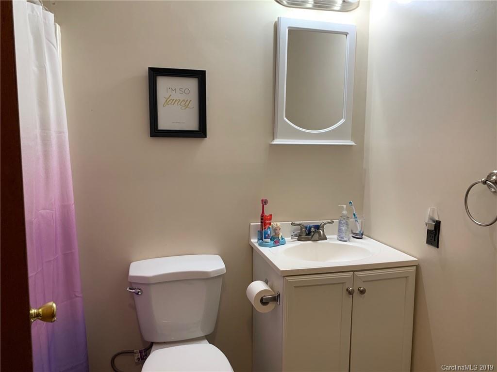 530 South Potter Road Lancaster, SC 29720 - Photo 16 of 21 a bathroom with a toilet sink and mirror