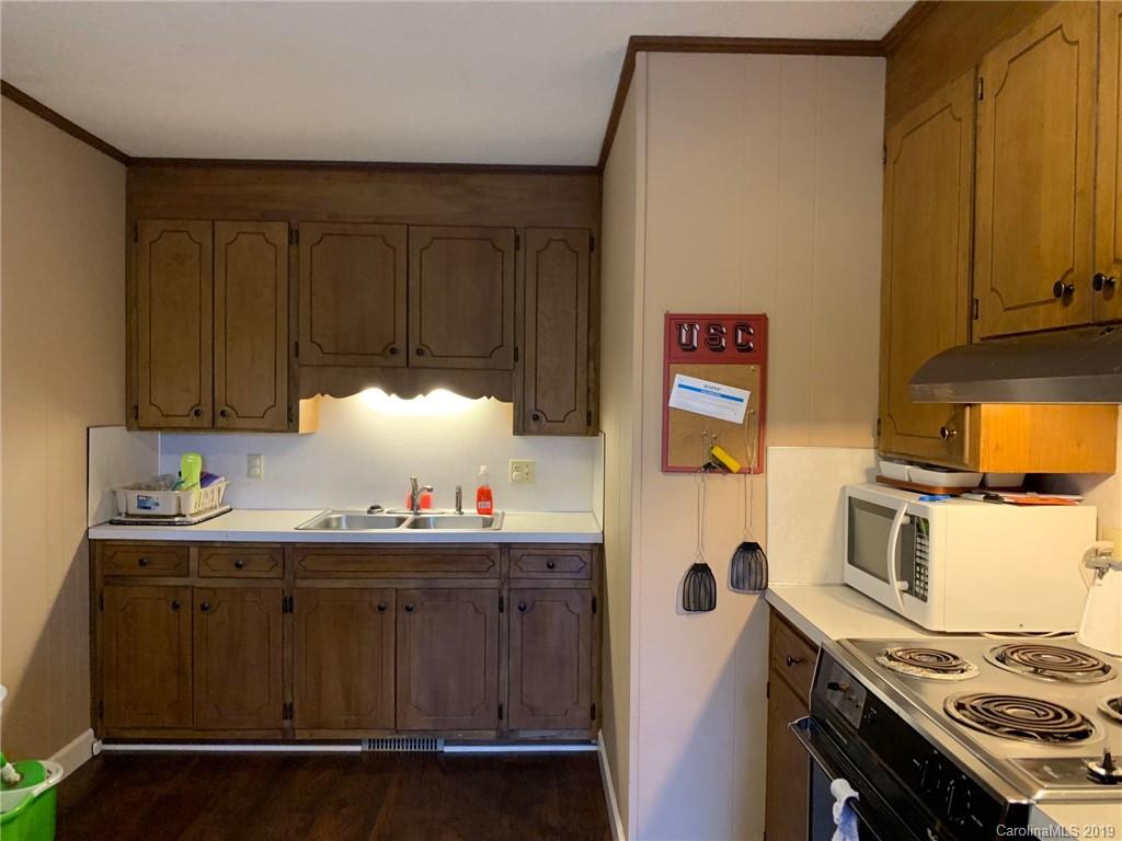 530 South Potter Road Lancaster, SC 29720 - Photo 7 of 21 a kitchen with stainless steel appliances a stove and a refrigerator