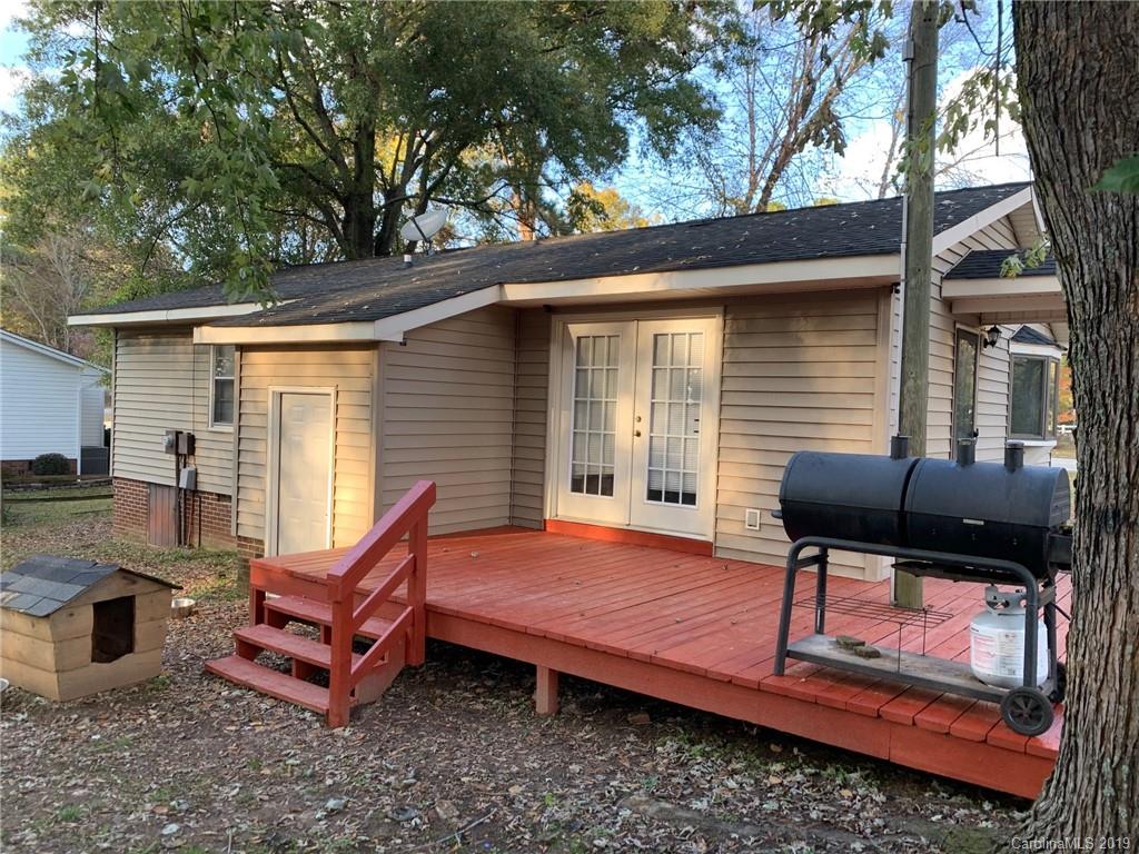 530 South Potter Road Lancaster, SC 29720 - Photo 8 of 21 a backyard of a house with wooden floor chairs sofa and barbecue oven