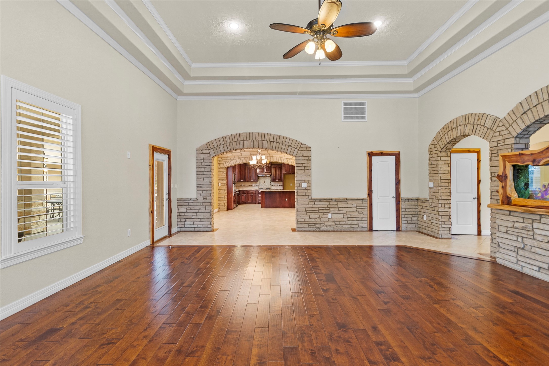 22321 Mossy Oaks Road Spring, TX 77389 - Photo 12 of 50 a view of empty room with wooden floor and fan