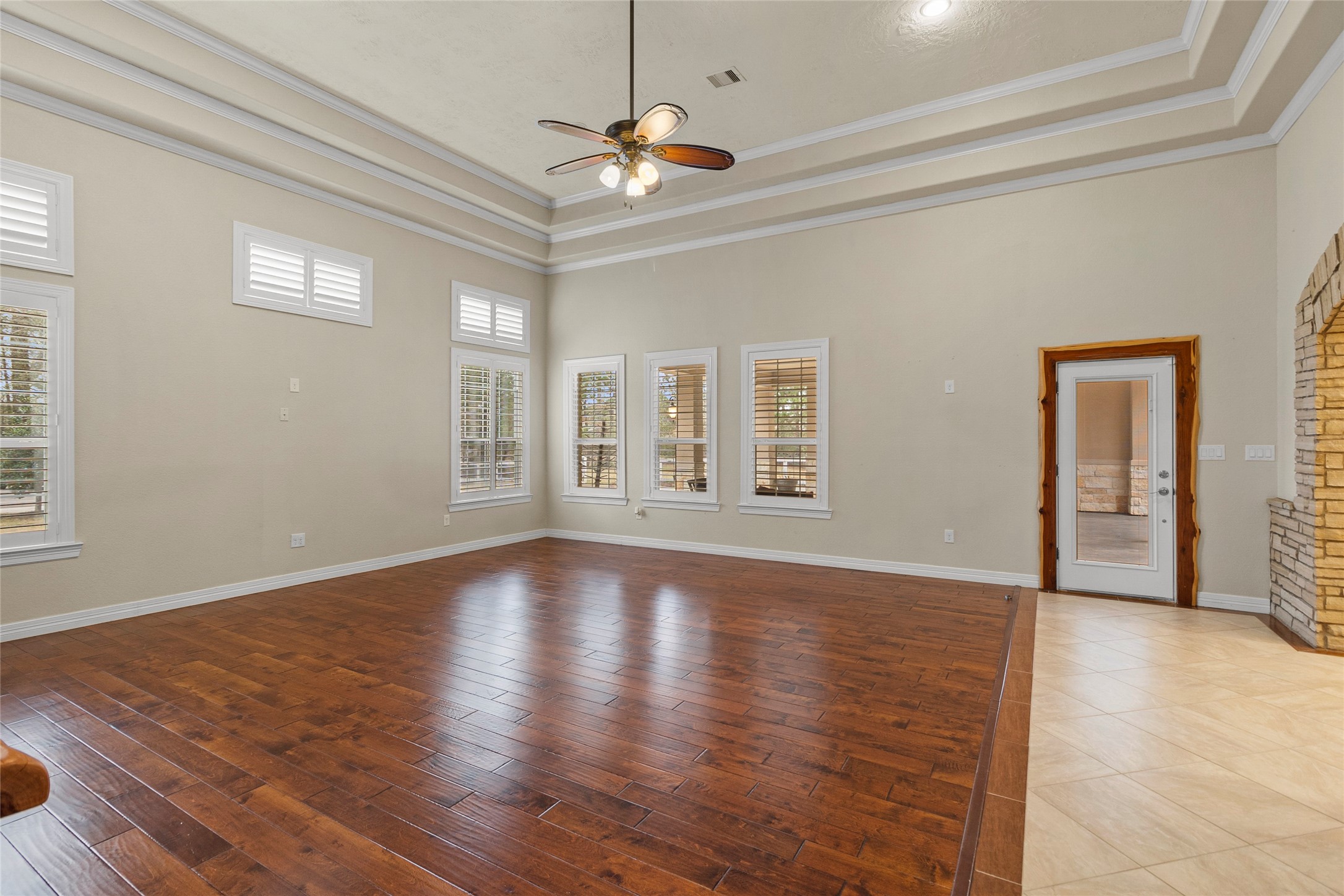 22321 Mossy Oaks Road Spring, TX 77389 - Photo 13 of 50 a view of an empty room with window and wooden floor