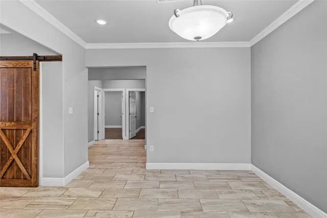 a view of room with window and wooden floor