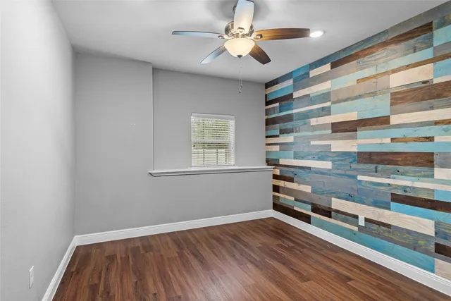 a view of hallway with wooden floor