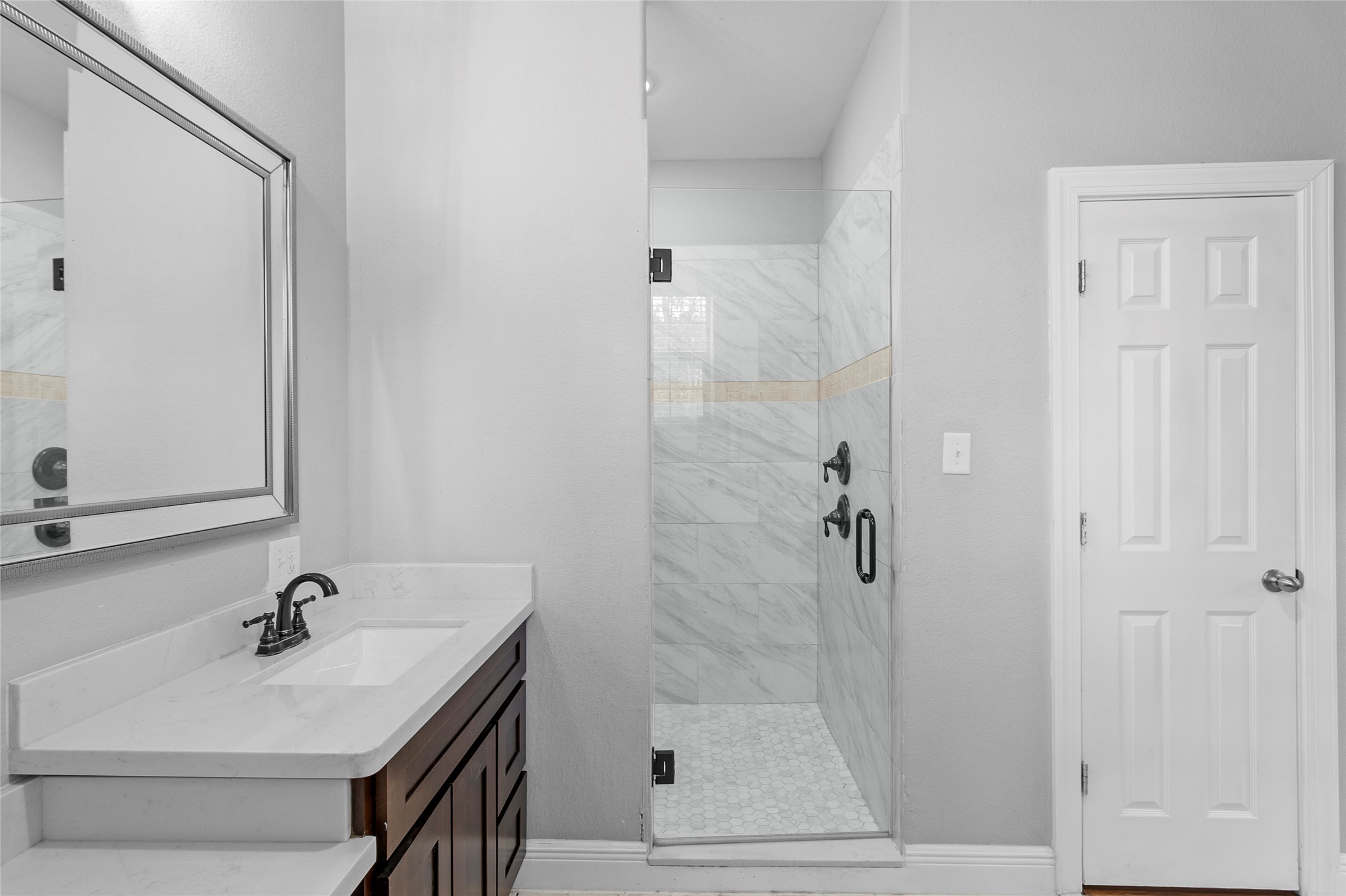 22321 Mossy Oaks Road Spring, TX 77389 - Photo 33 of 50 a bathroom with a sink vanity granite tub and shower