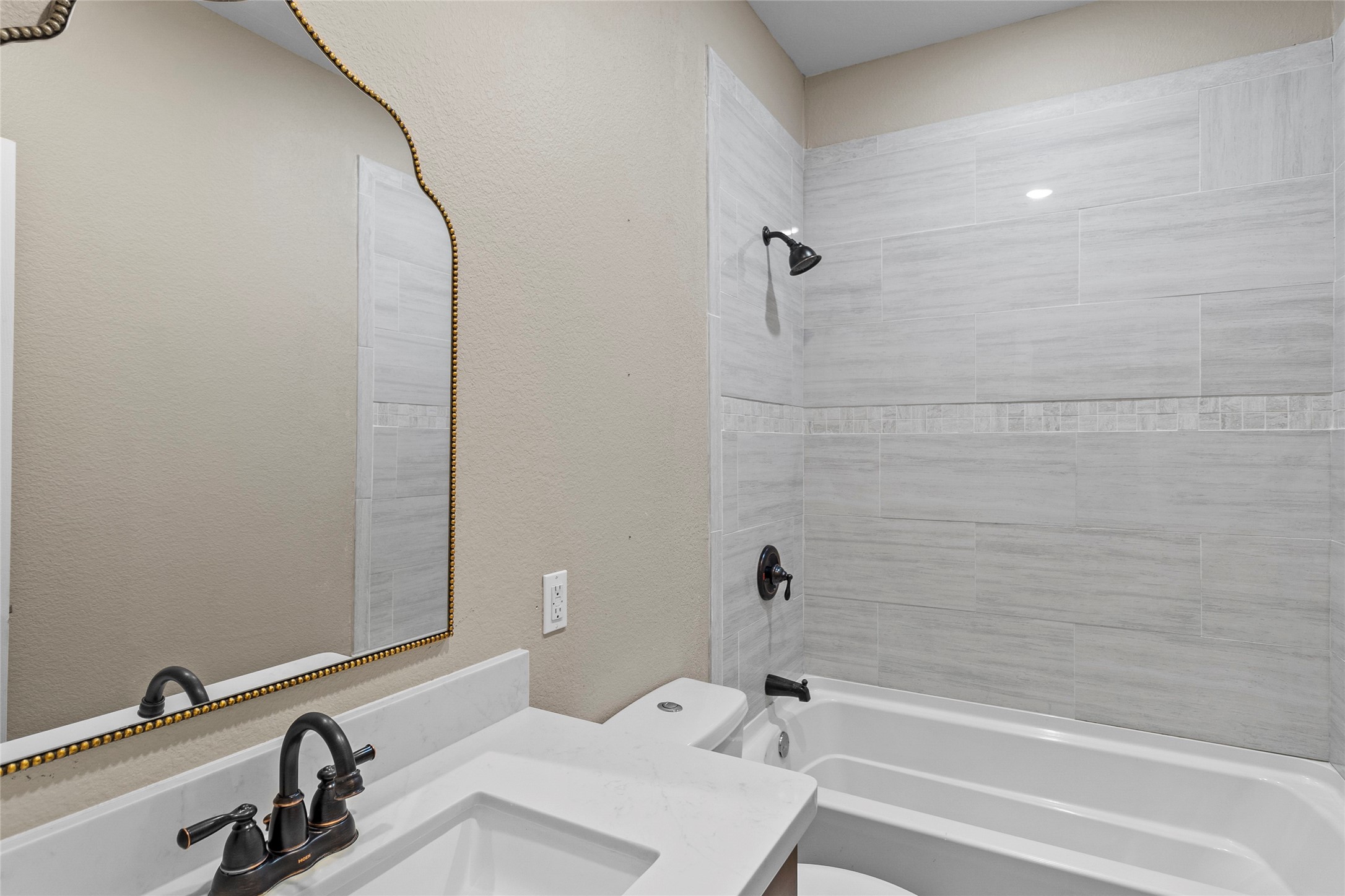 22321 Mossy Oaks Road Spring, TX 77389 - Photo 37 of 50 a bathroom with a sink and a bathtub