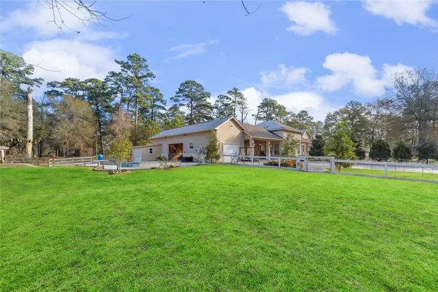 a view of room with hardwood floor and ceiling fan