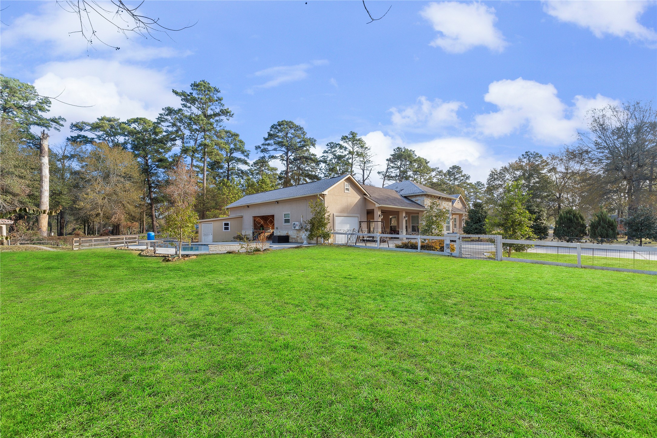 22321 Mossy Oaks Road Spring, TX 77389 - Photo 4 of 50 a front view of a house with garden