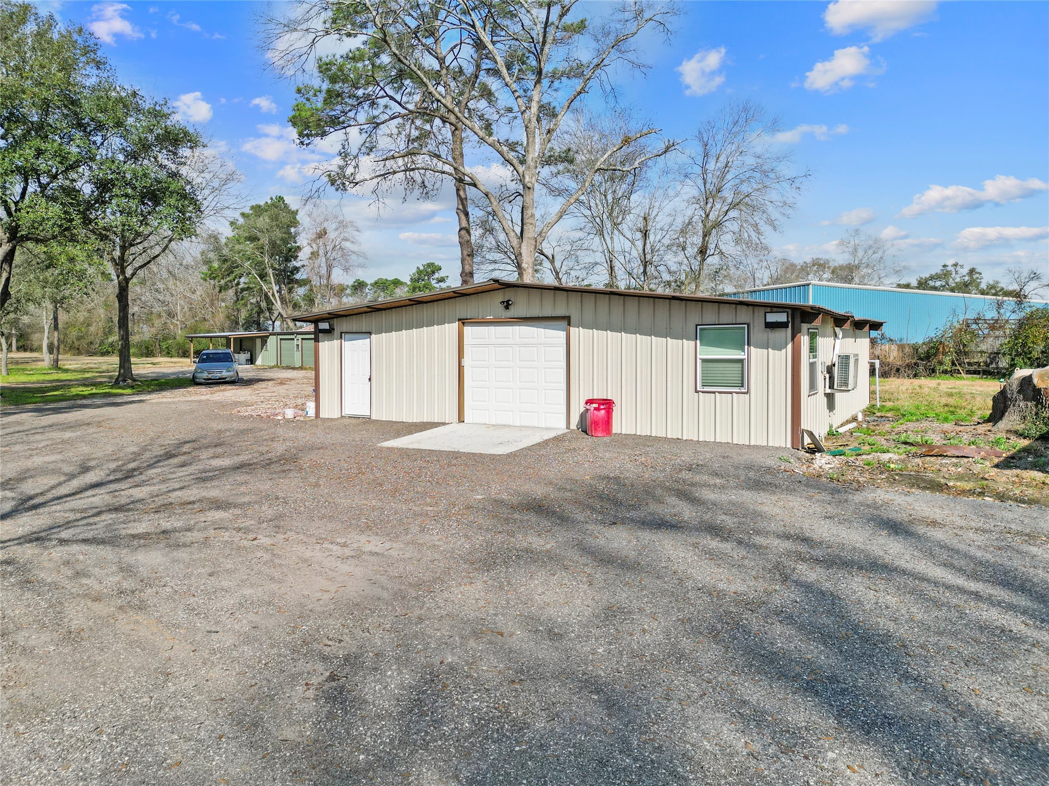 22321 Mossy Oaks Road Spring, TX 77389 - Photo 46 of 50 a view of white house with a yard and garage