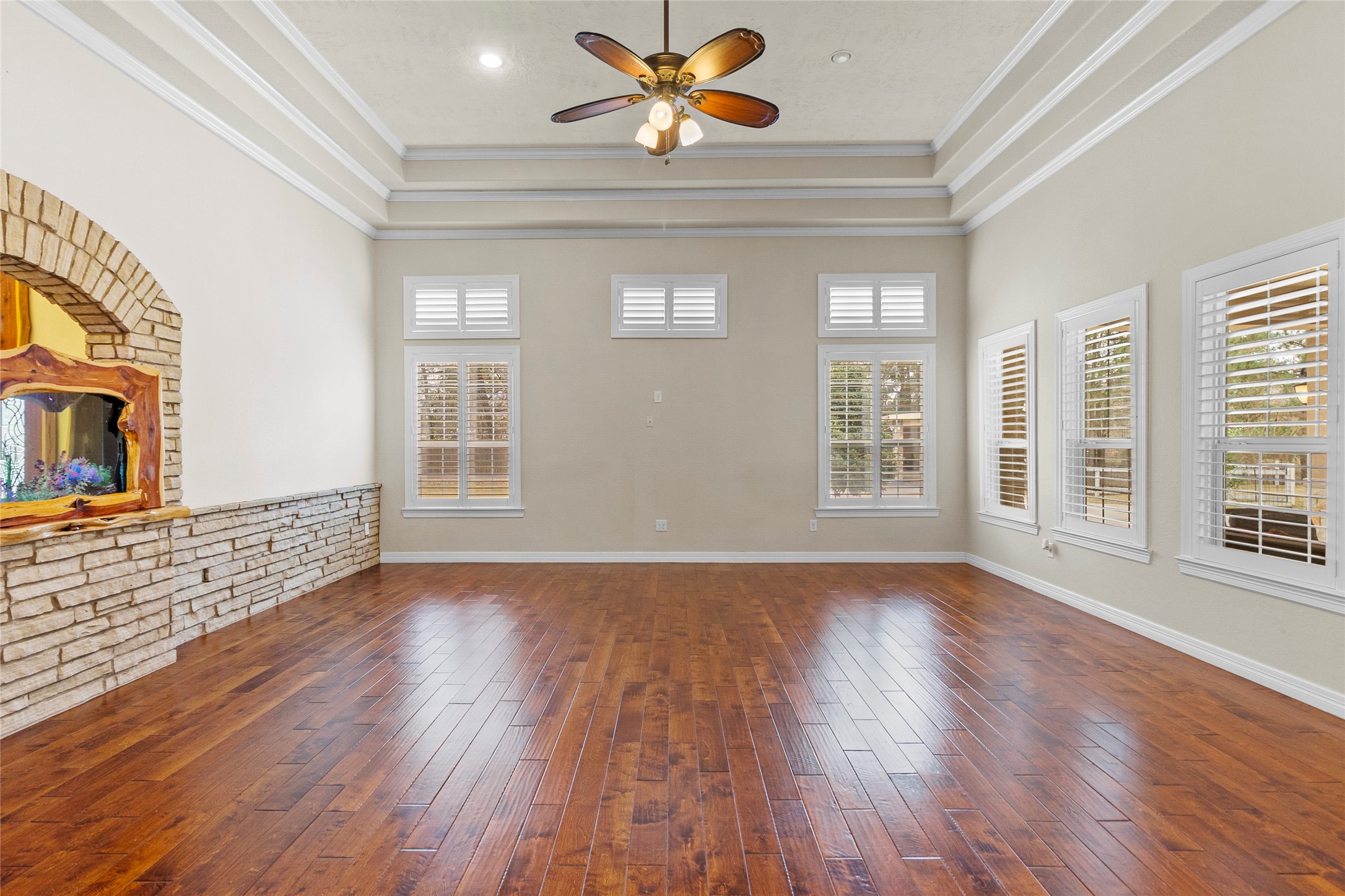 22321 Mossy Oaks Road Spring, TX 77389 - Photo 9 of 50 a view of an empty room with window and wooden floor