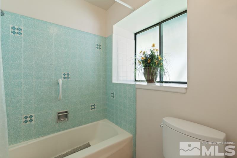 2301 Crescent Circle Reno, NV 89509 - Photo 20 of 40 a bathroom with a bathtub and a toilet
