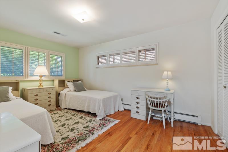 2301 Crescent Circle Reno, NV 89509 - Photo 23 of 40 a bedroom with two beds and a desk