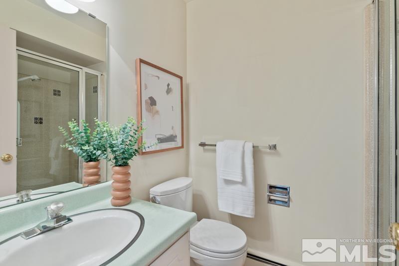 2301 Crescent Circle Reno, NV 89509 - Photo 25 of 40 a bathroom with a sink a toilet and shower
