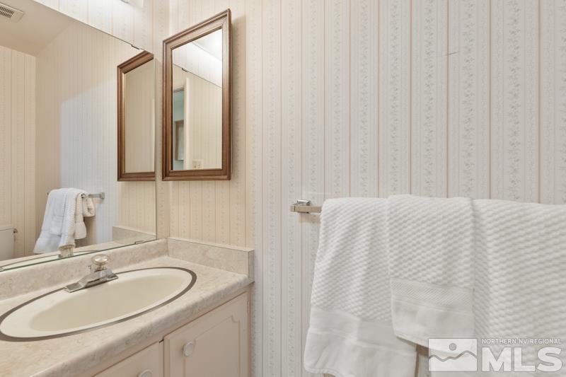 2301 Crescent Circle Reno, NV 89509 - Photo 28 of 40 a bathroom with a sink and a mirror