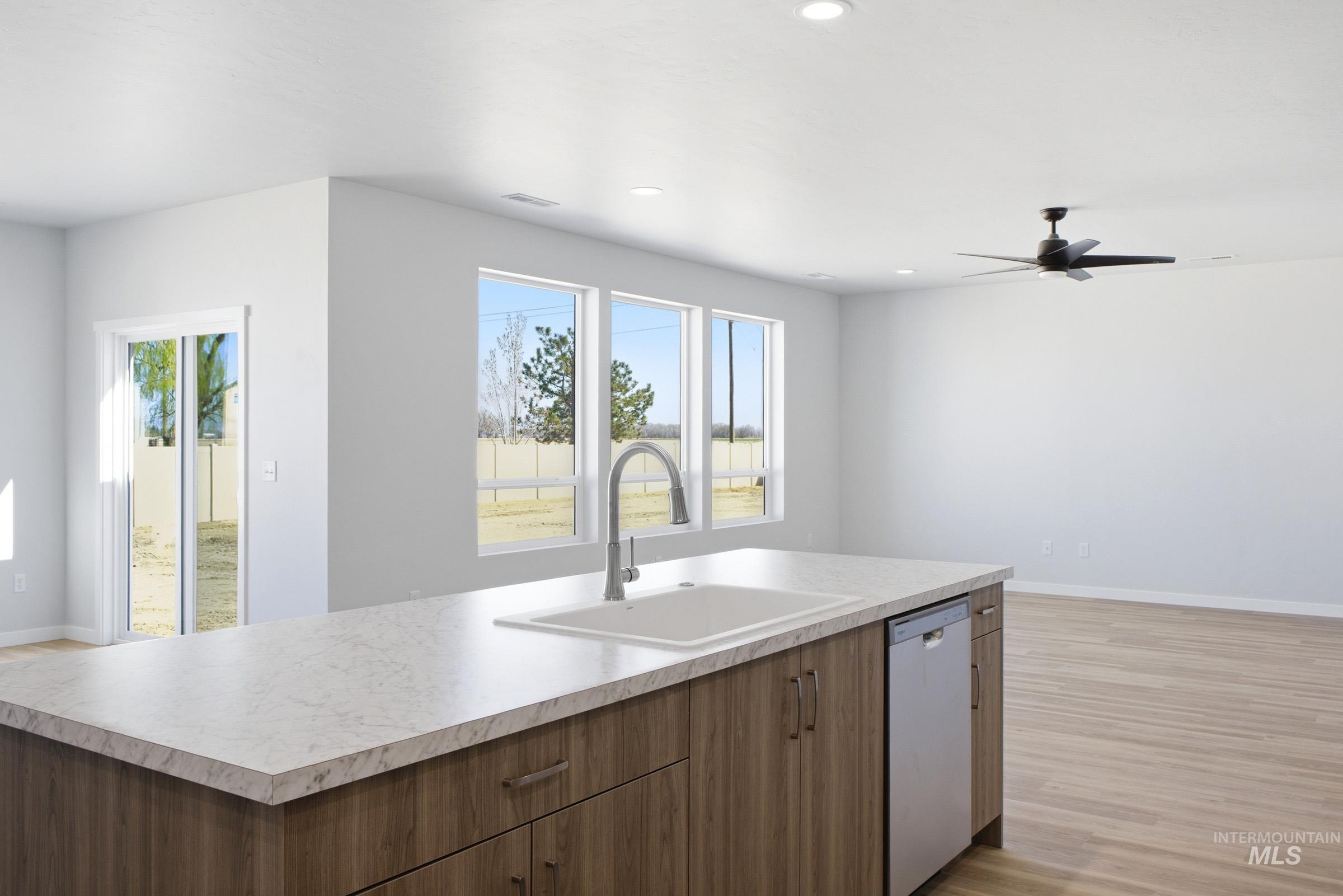 13633 Redway Court Caldwell, ID 83607 - Photo 5 of 29 Kitchen with light countertops, dishwasher, a ceiling fan, light wood-type flooring, and recessed lighting