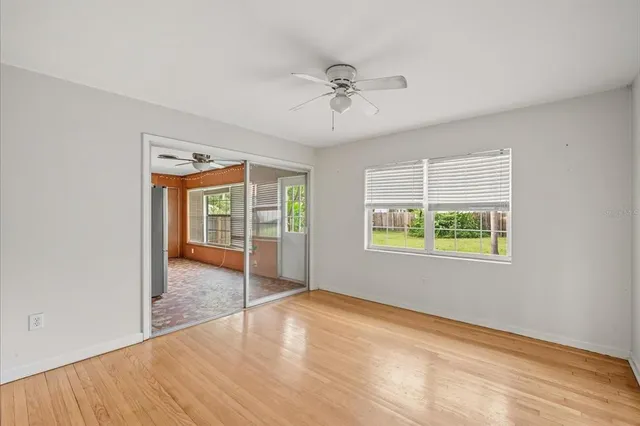 a view of an empty room with a window
