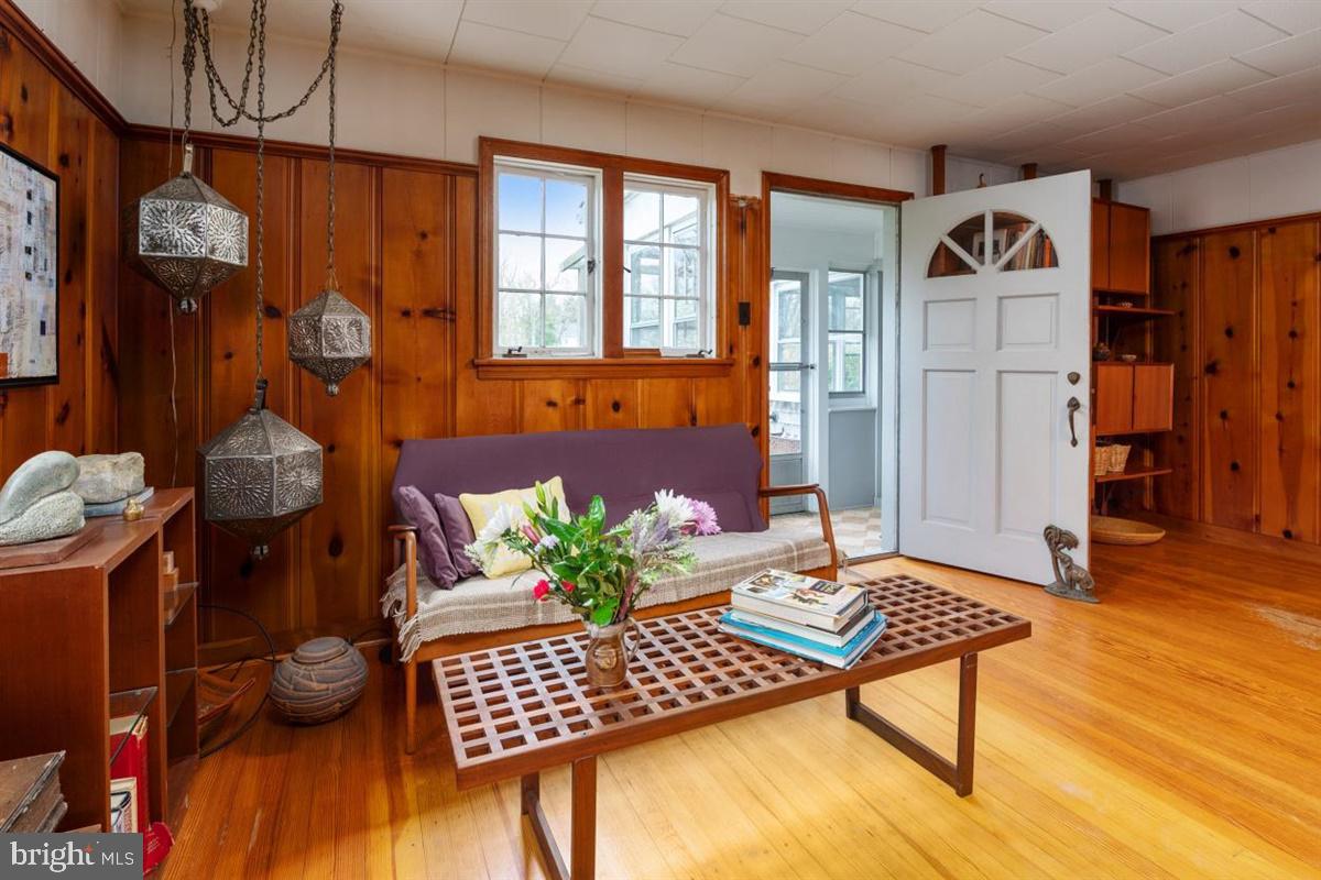 677 Red Cedar Road Annapolis, MD 21409 - Photo 23 of 44 The living area opens to the sunporch and exit to