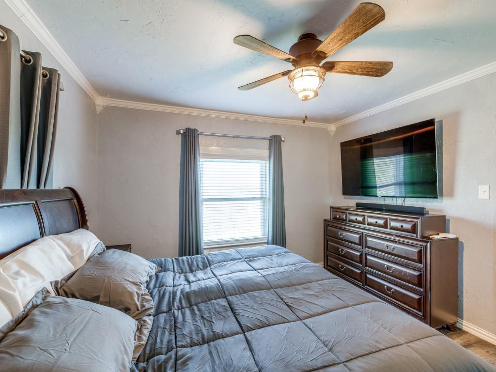 3061 Turkey Creek Road Sunset, TX 76270 - Photo 12 of 31 a bedroom with a bed and a flat screen tv