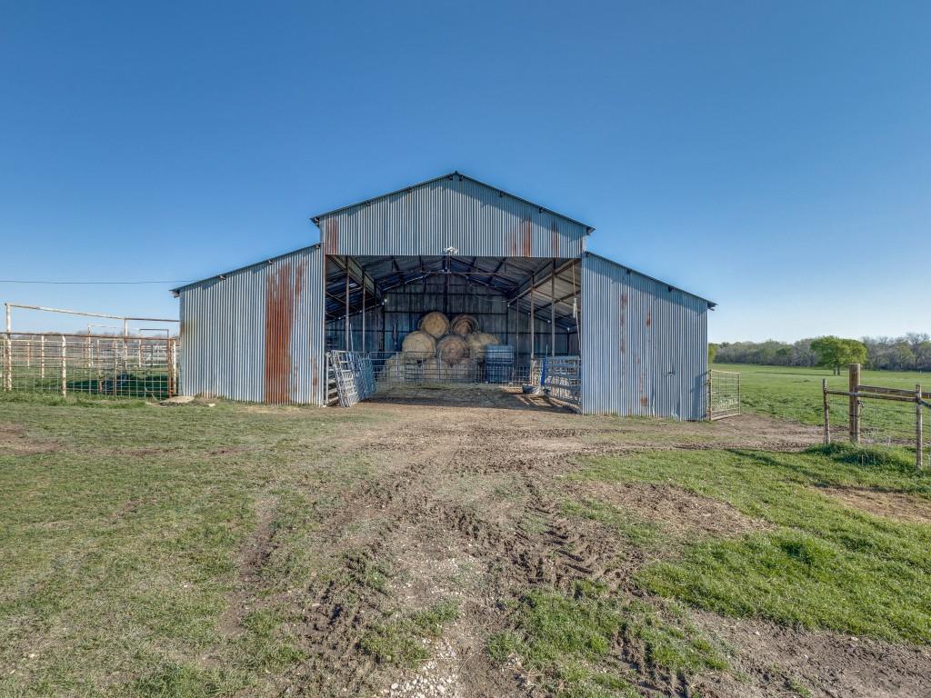 3061 Turkey Creek Road Sunset, TX 76270 - Photo 21 of 31 a view of a house with backyard and garden